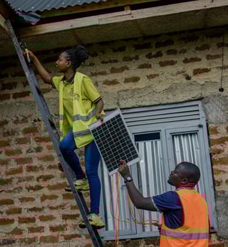 Imagine Her April 2026 Featured Grantee - Woman Installing Solar Panel